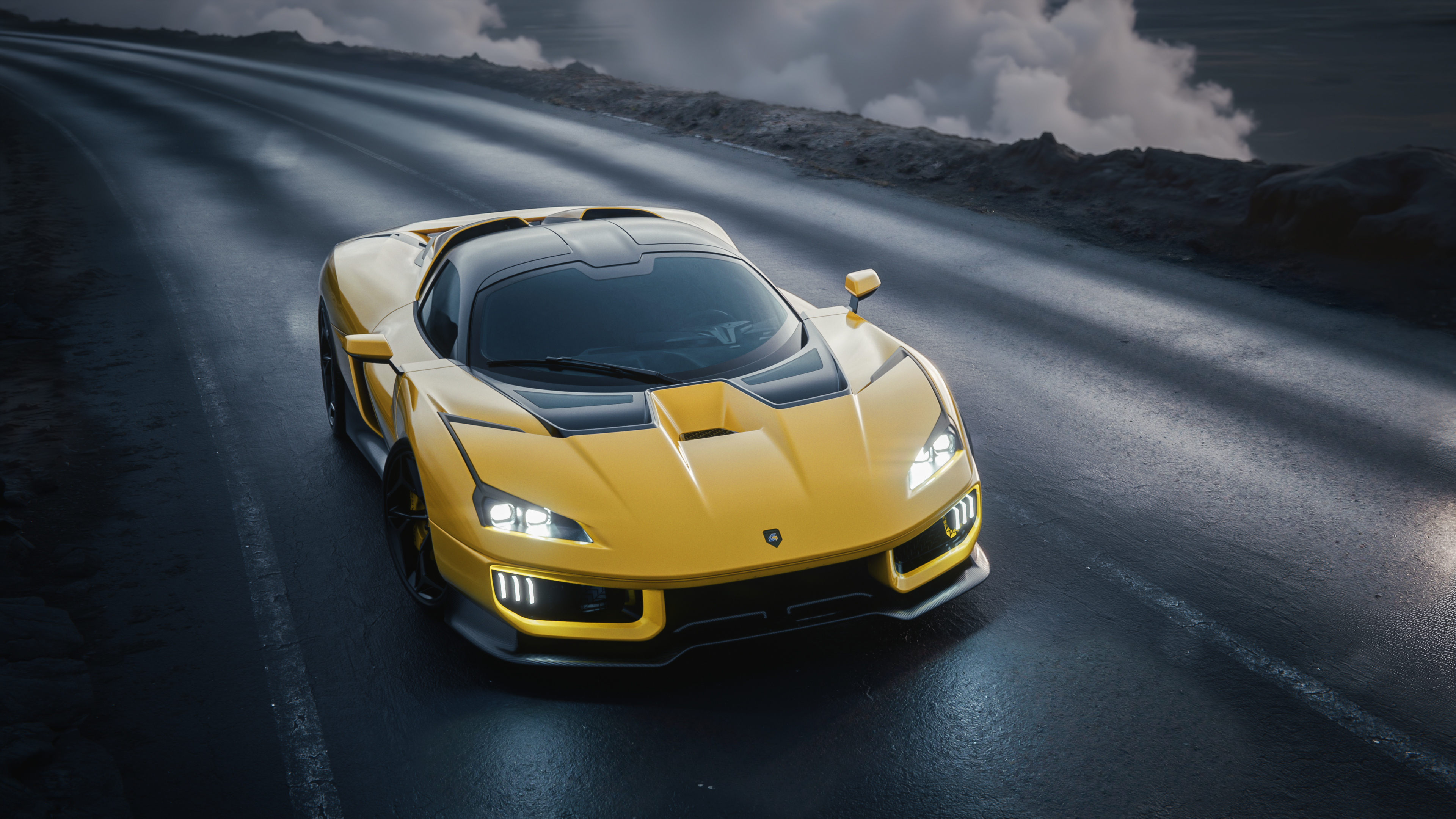 A yellow Giamaro Katla hypercar front view on a road with mountains.