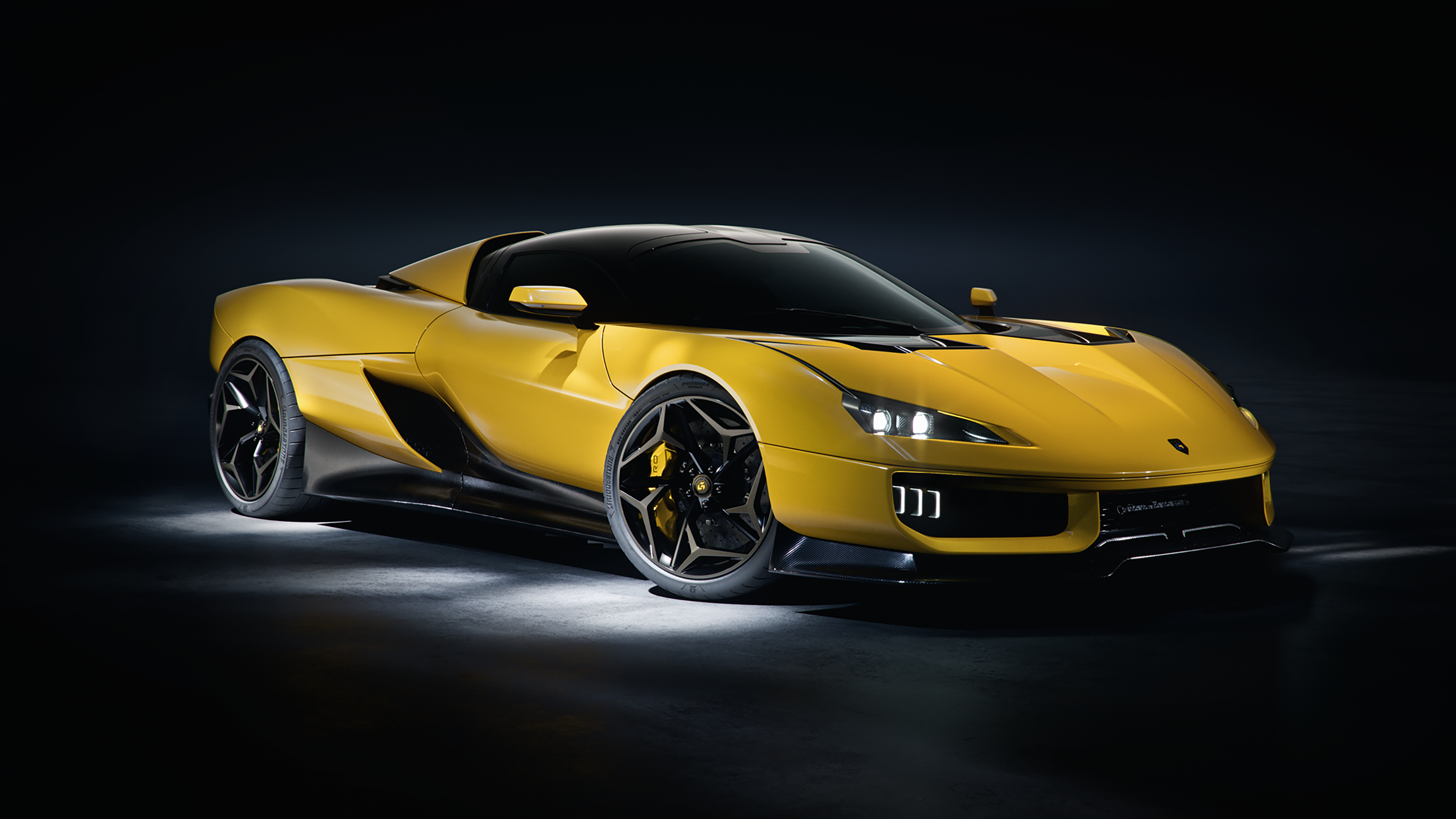 A yellow Giamaro Katla hypercar from the front three-quarter view.