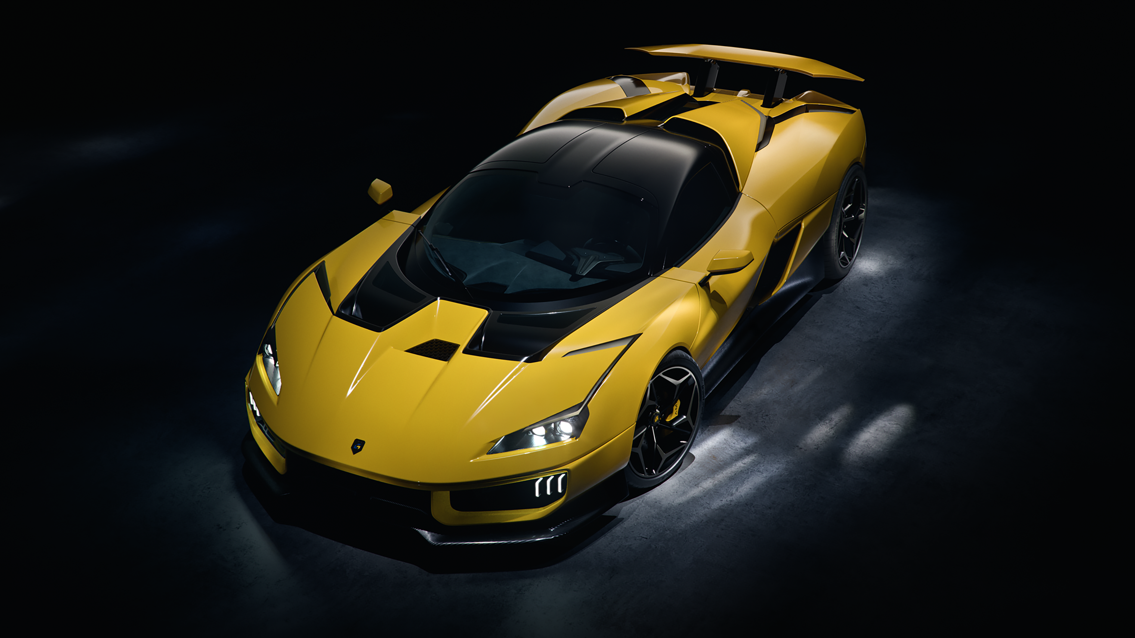 A yellow Giamaro Katla hypercar in a dark studio setting.