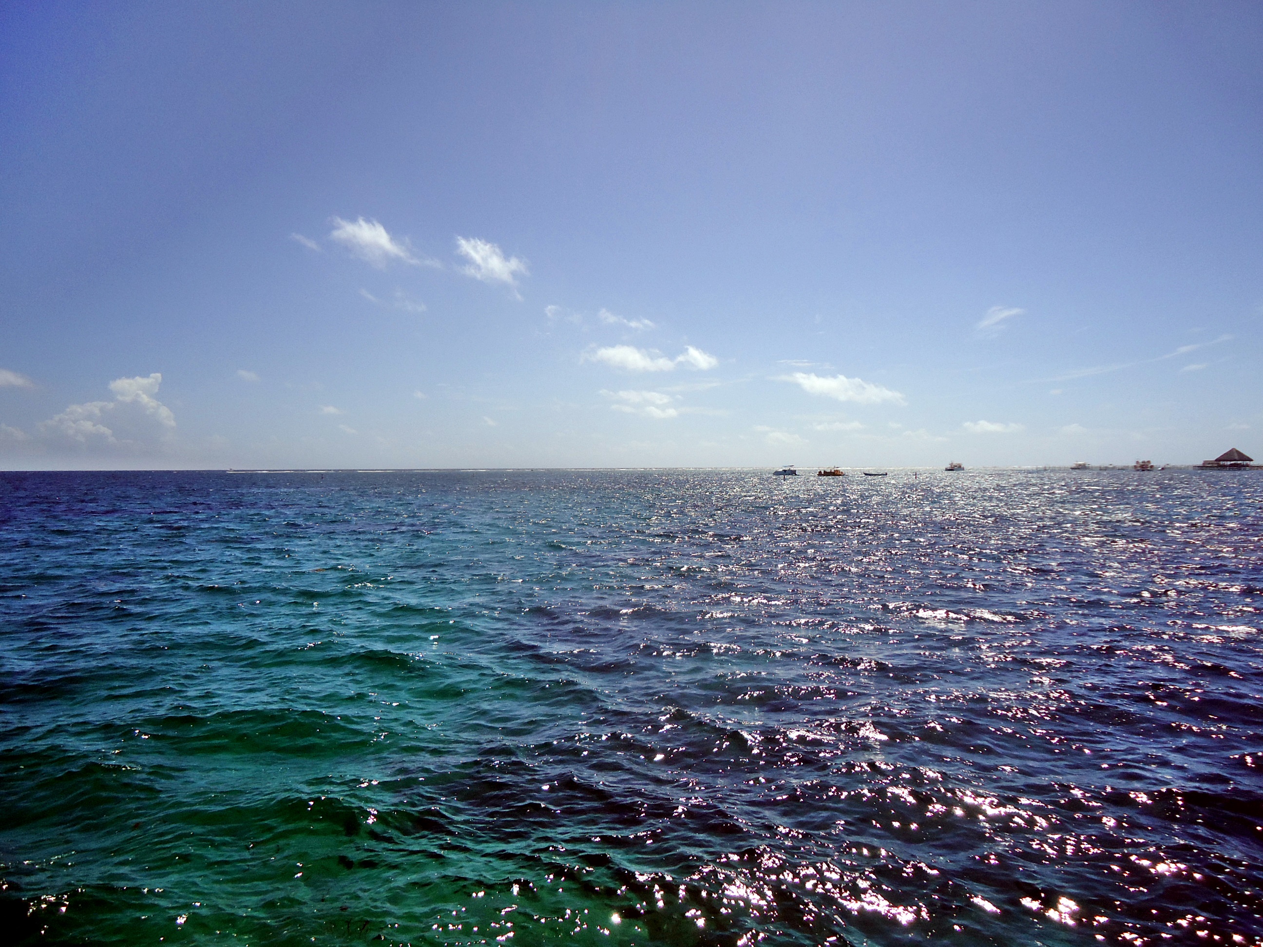 The open waters of the Caribbean Sea, in various shades of blue and purple.