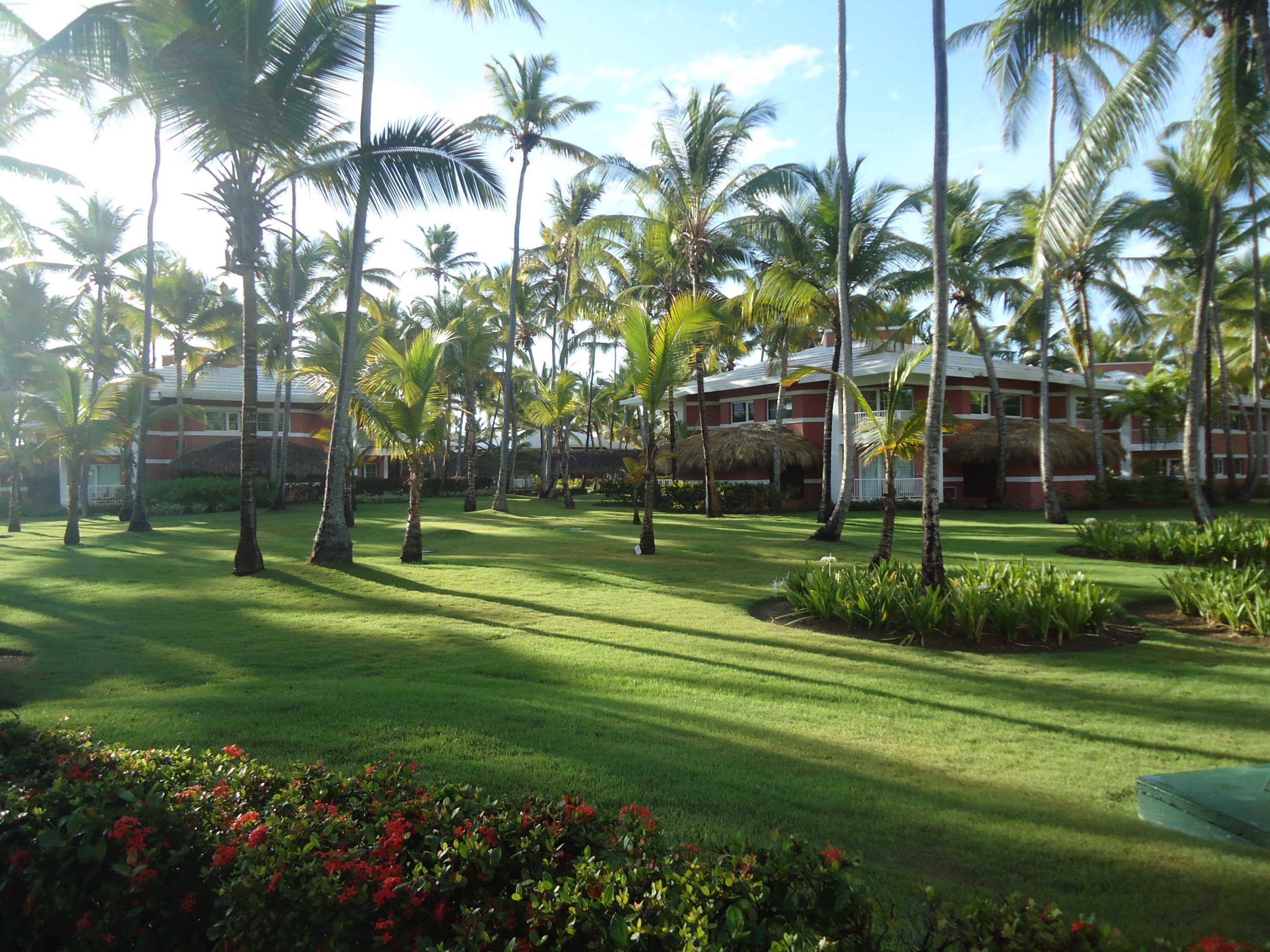 Luxury houses in the Grand Palladium resort area, surrounded by palm trees in Punta Cana.